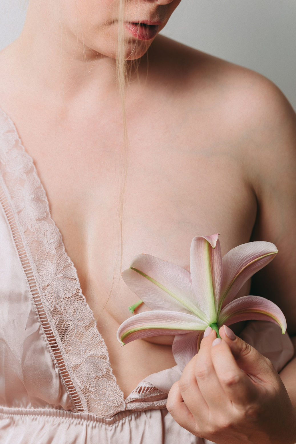 Calla Lily Covering Woman's Breast